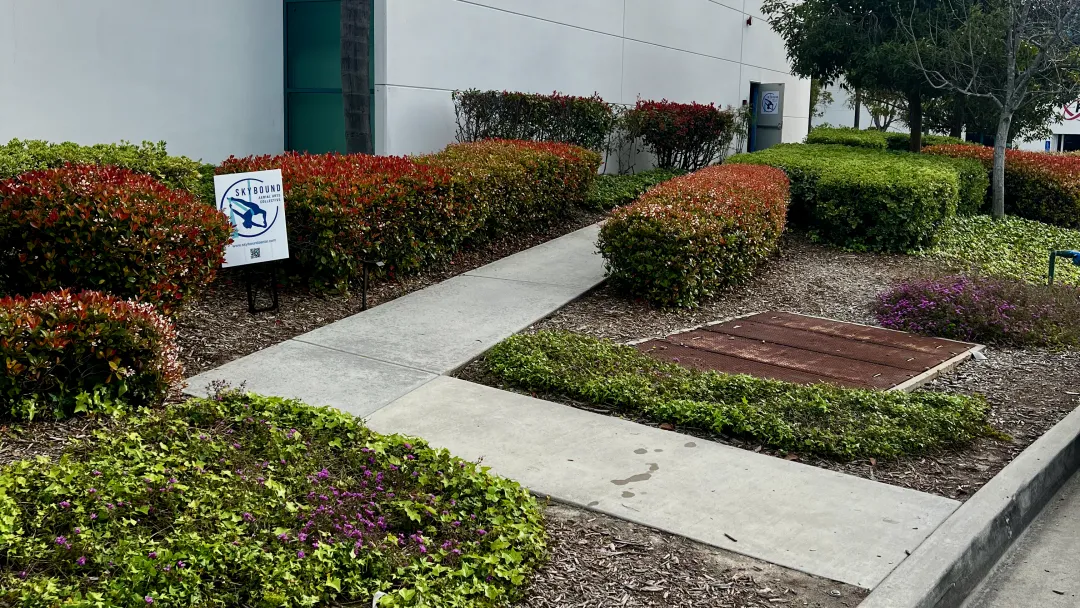skybound aerial business entrance walkway from progress street